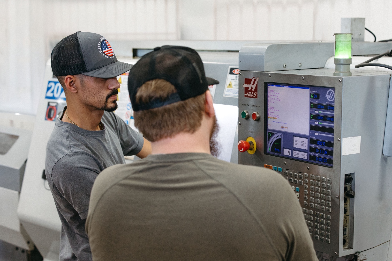 Cherry Creek Machine machinists programming a Haas CNC lathe in Tulsa, Oklahoma
